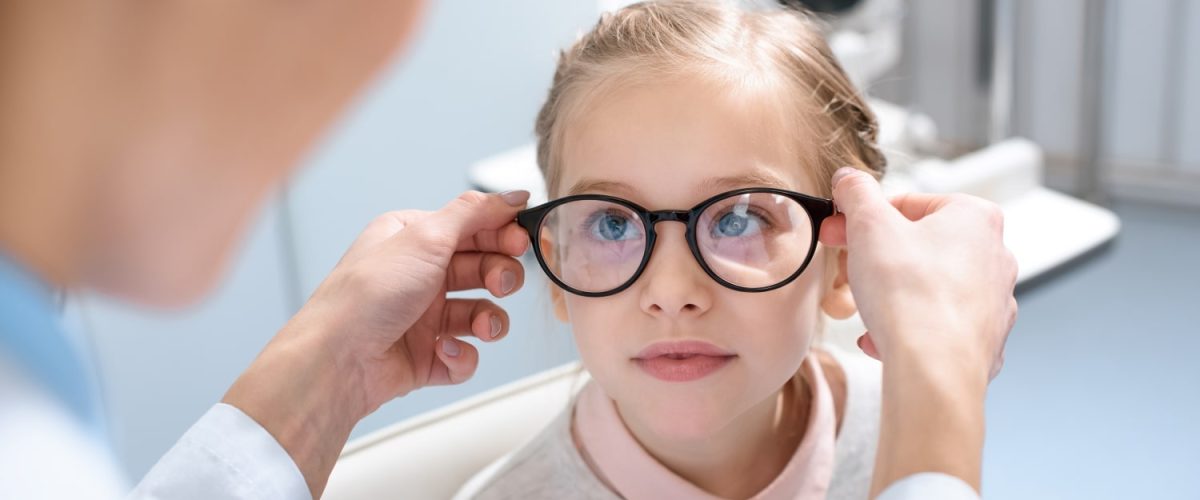optometrist-and-little-kid-in-glasses-in-optics-2022-12-16-21-23-02-utc-min.jpg